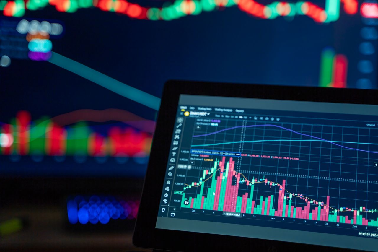 Colorful trading charts showing cryptocurrency market trends on a computer screen.